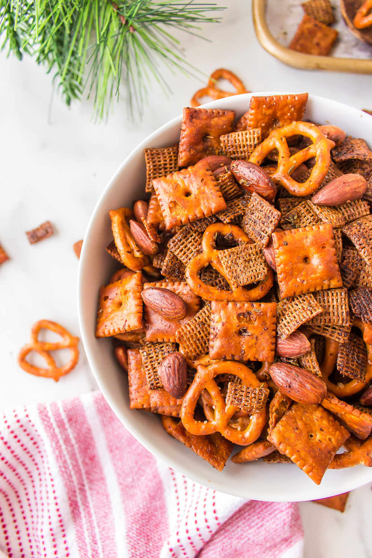 Chex Mix in a bowl on a table.