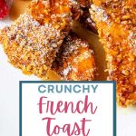 Crunchy French Toast Sticks with syrup on a plate with berries.