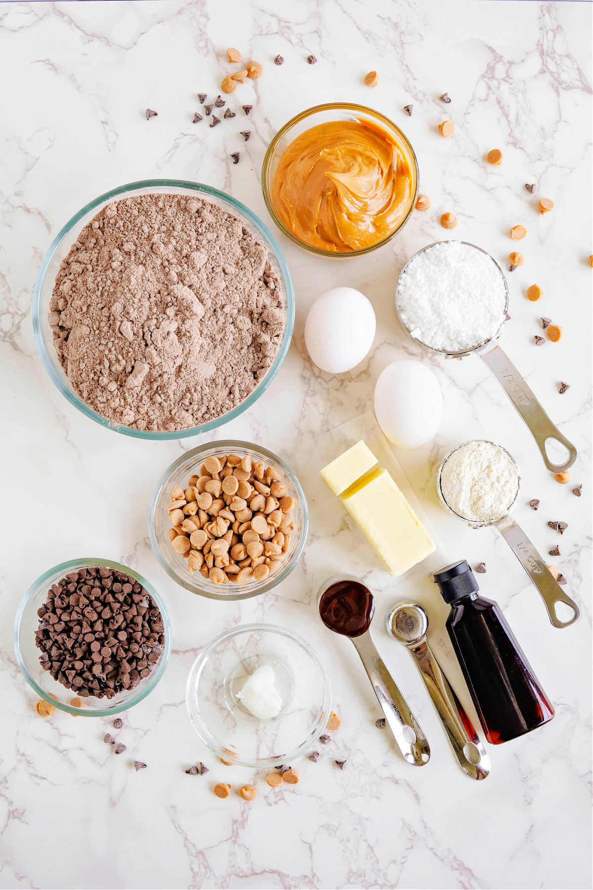 ingredients for fudgy peanut butter brownie cookies on a table.