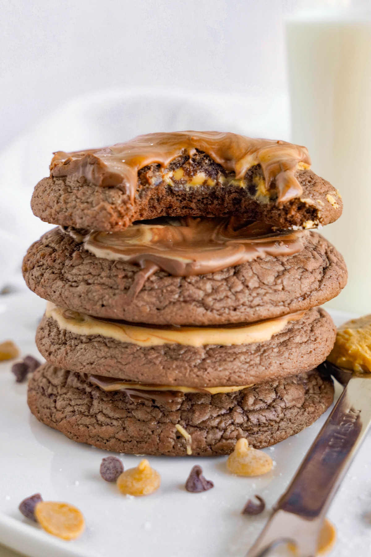 fudgy peanut butter brownie cookies stacked on top of each other.