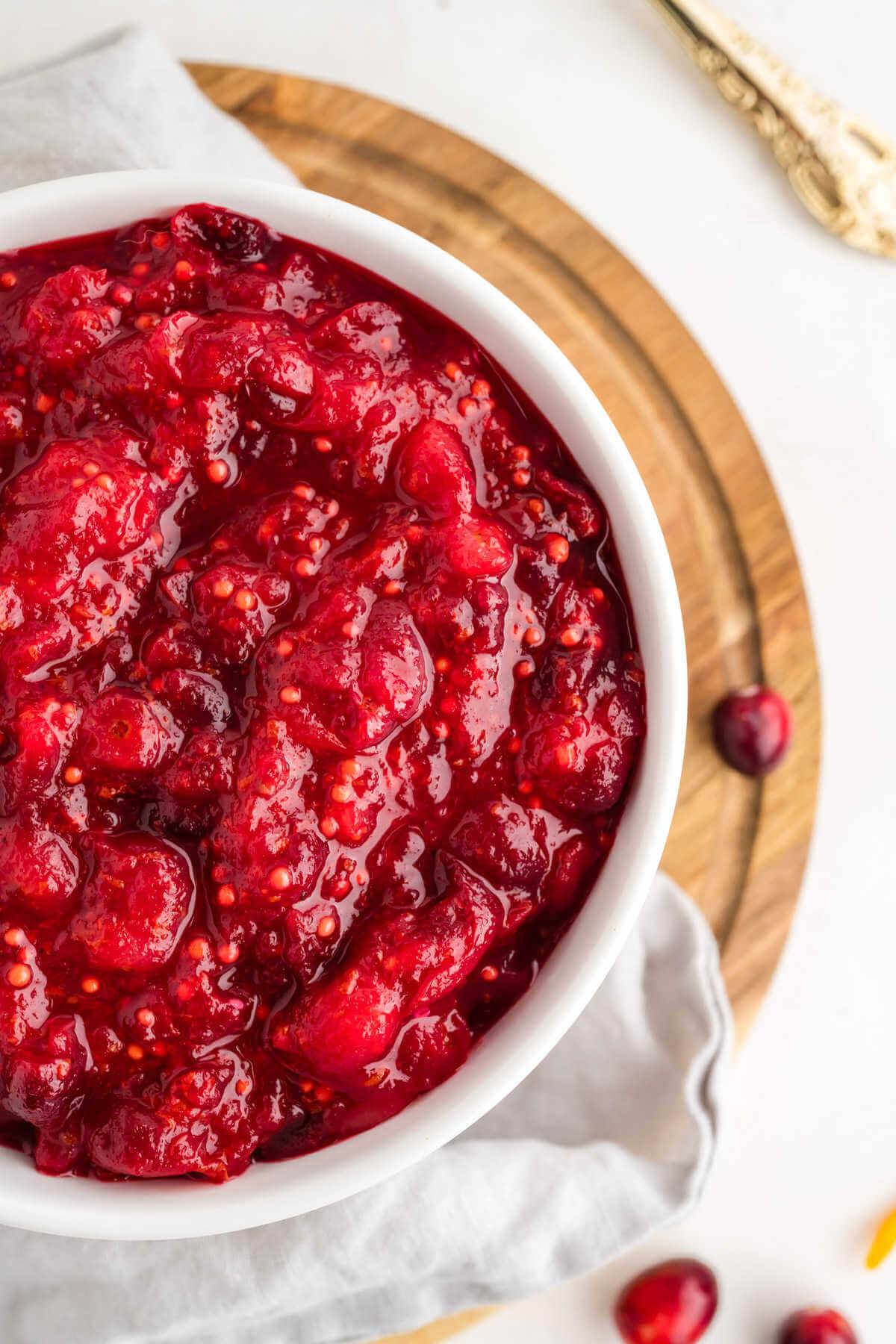 closeup image of a bowl of cranberry chutney on a table.