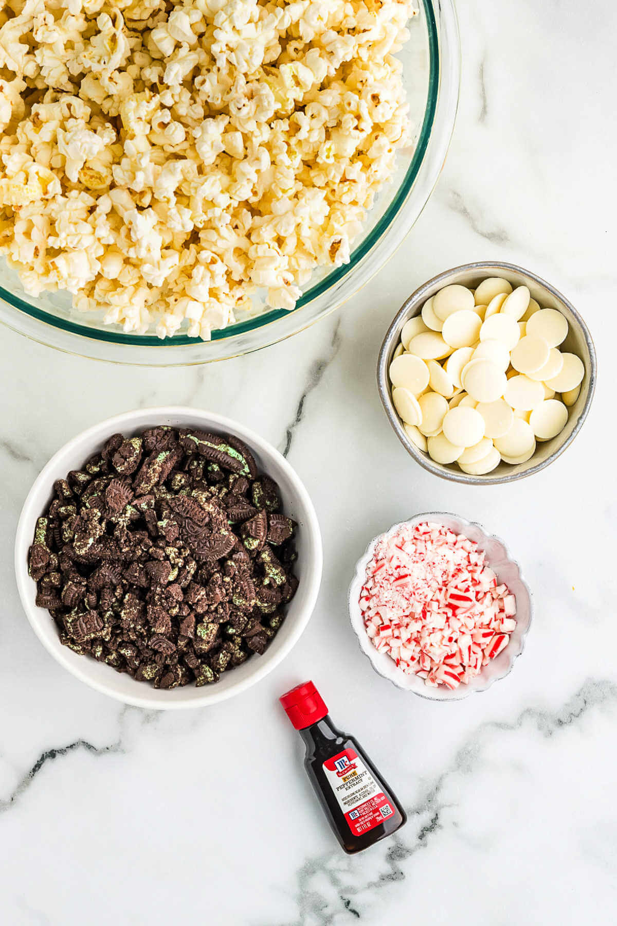 ingredients for white chocolate popcorn on a table.