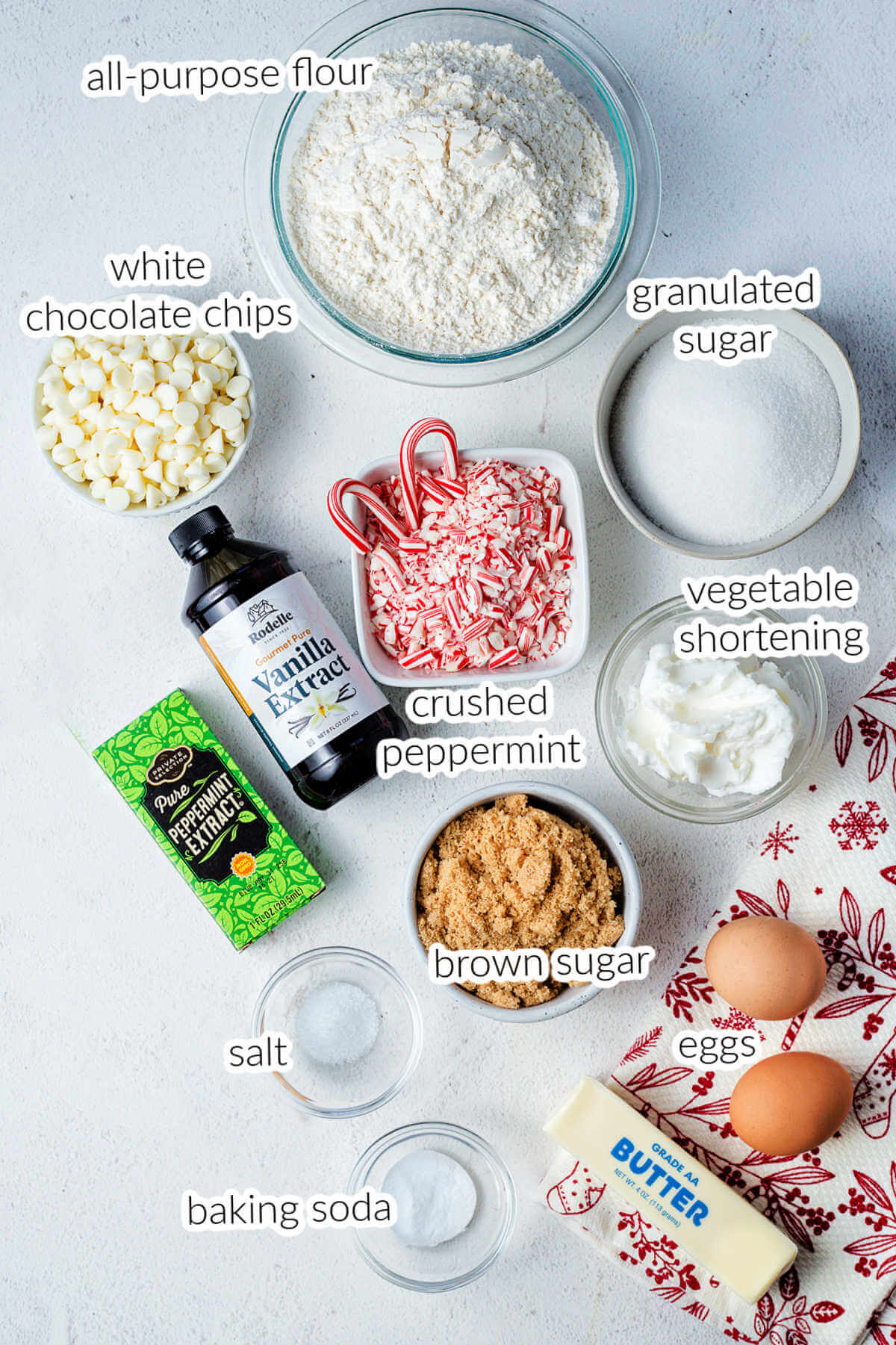 ingredients for white chocolate chip peppermint cookies on a table.