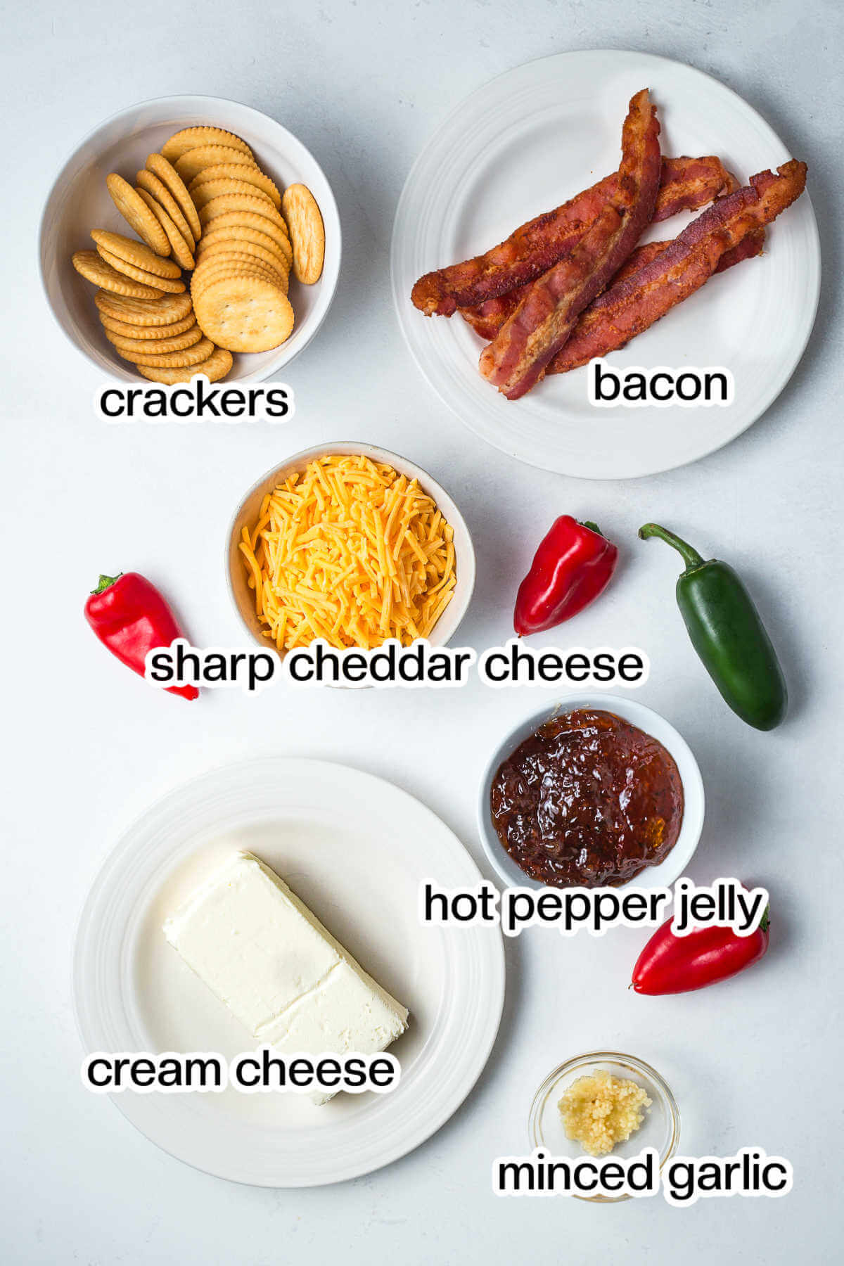 Ingredients for hot pepper jelly cheese dip on a table.