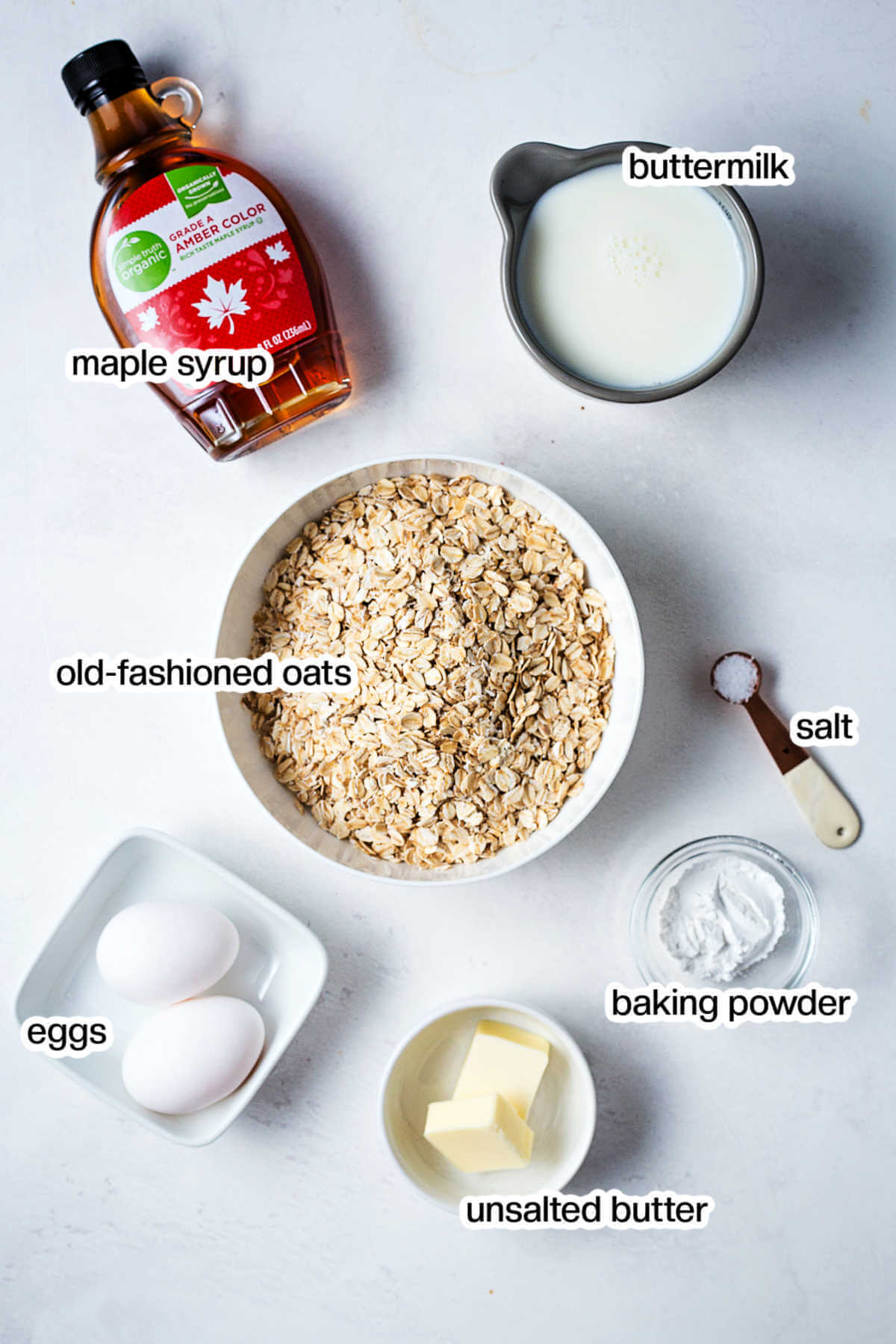 Ingredients for making pancakes with oat flour pancakes on a table.