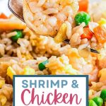 A bite of Shrimp and Chicken Fried Rice on a fork.