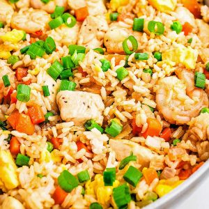 shrimp and chicken fried rice in a skillet.