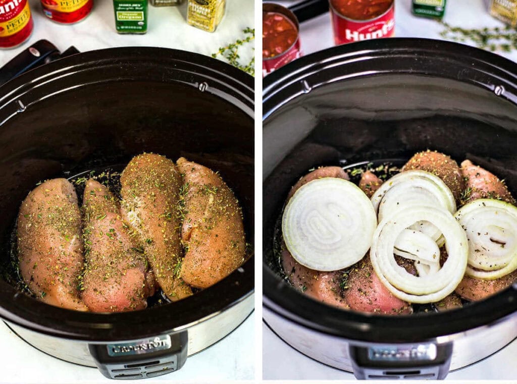 Chicken breasts sprinkled with herbs and sliced onions in a slow cooker.