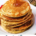 A stack of oat flour pancakes with maple syrup on a table.