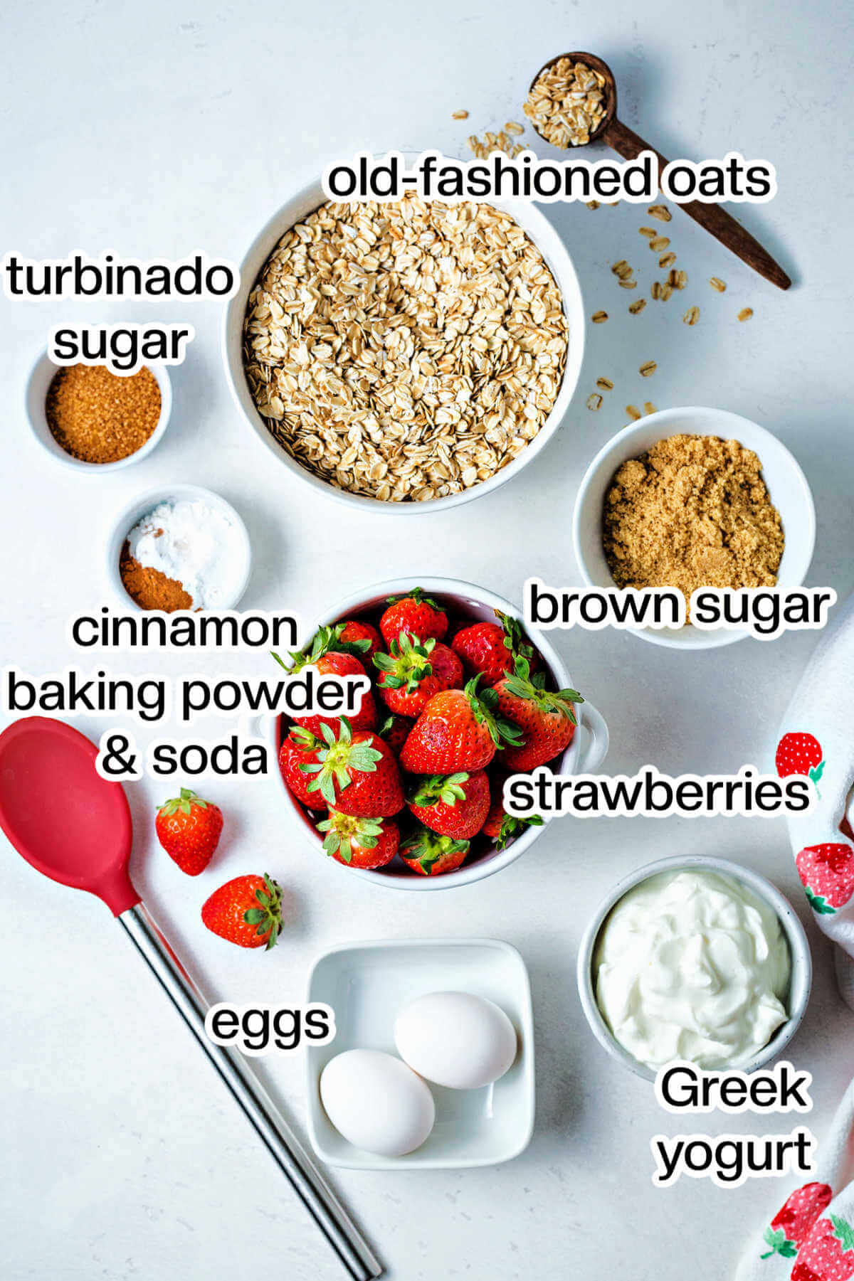 Ingredients for strawberry oat muffins on a table.