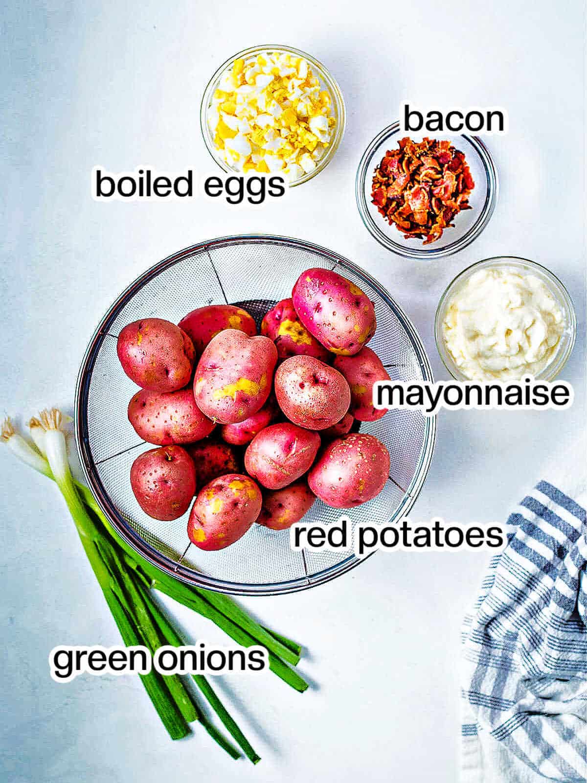 Ingredients for red potato salad on a table.
