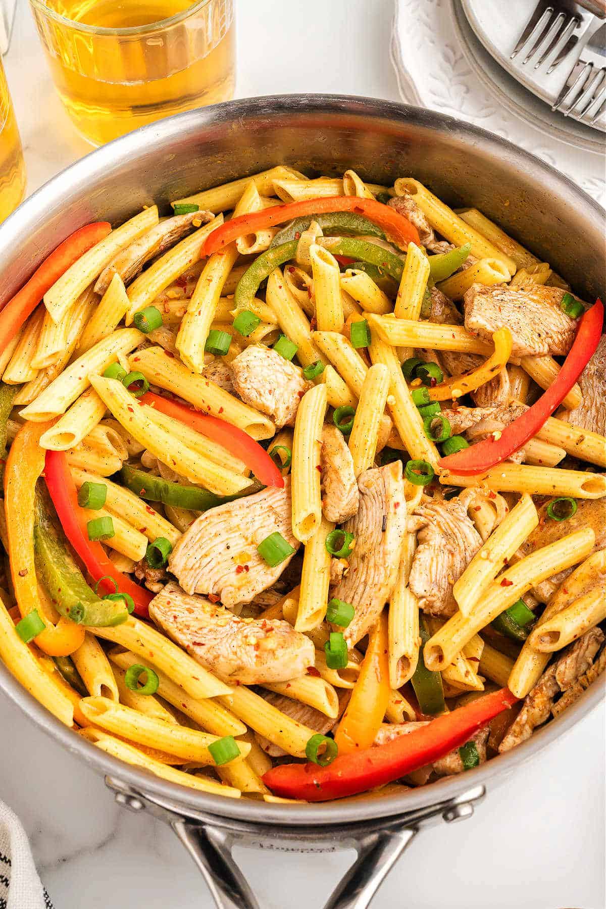 Rasta Pasta Recipe made in a large skillet and sitting on a table.