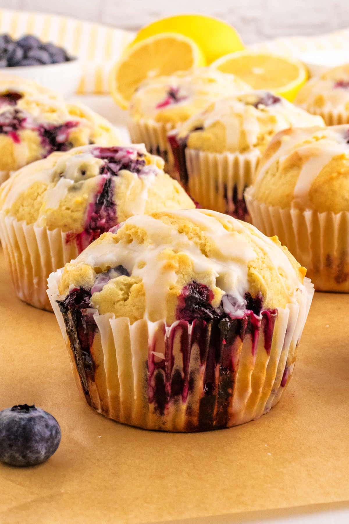 Side view of blueberry muffins on a table.