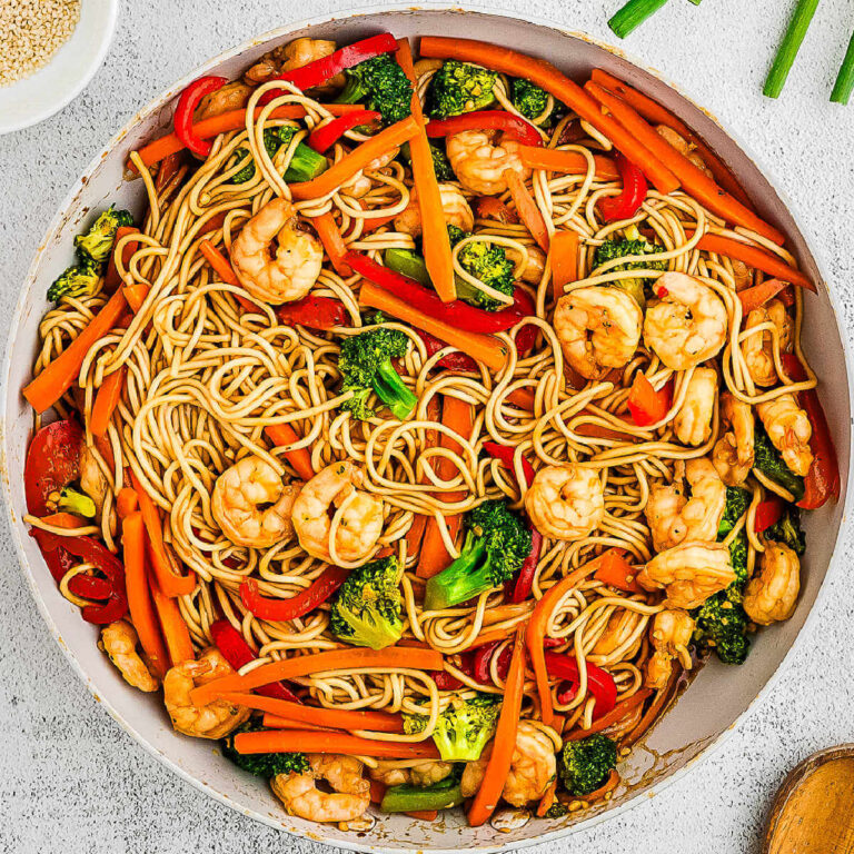 Shrimp Lo Mein in a skillet on a table.