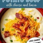 Loaded Potato Soup topped with cheese and bacon in a bowl.
