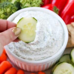 Cottage Cheese Dill Dip in a bowl surrounded by fresh veggies.
