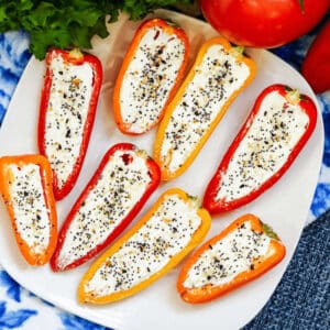 Cream Cheese stuffed peppers on a plate.