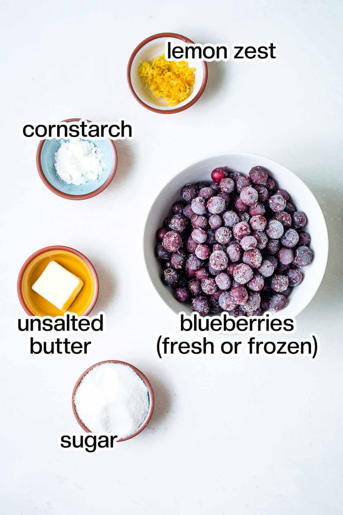 Ingredients for blueberry compote on a table.