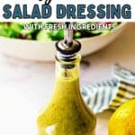 Greek salad dressing in a carafe on a table.