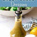 Greek salad dressing in a carafe on a table.
