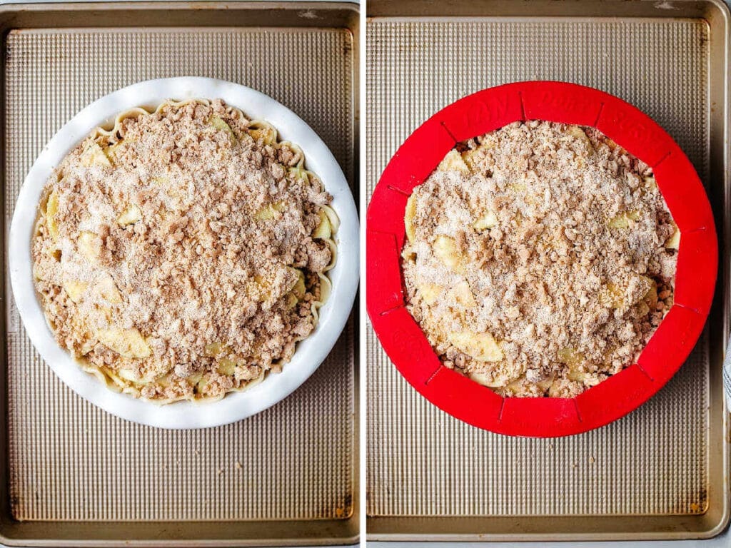 An apple crumble pie ready for the oven with a pie shield wrapped around the edges of the crust.