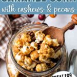 Homemade Caramel Corn in a jar on a table.