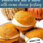 Pumpkin Whoopie Pies with Cream Cheese Filling on a plate.