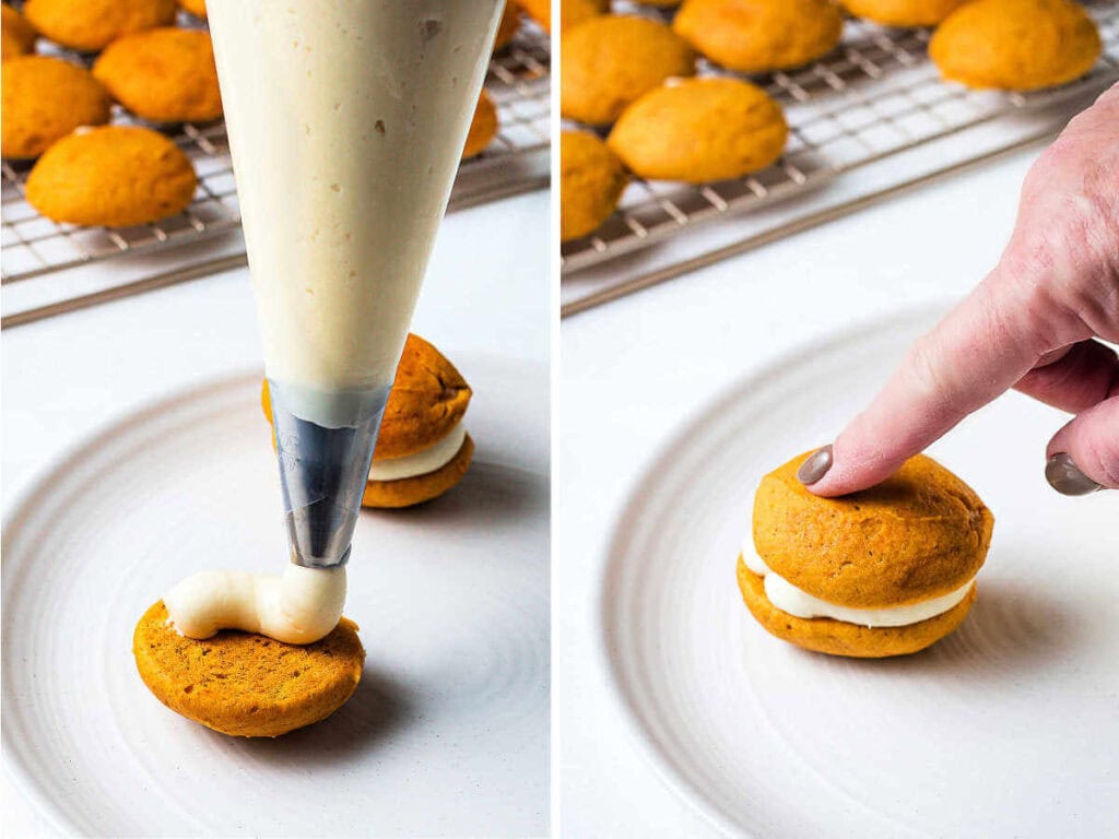 Piping cream cheese frosting onto a cookie; pressing a second cookie on top of filling to assemble a whoopie pie.