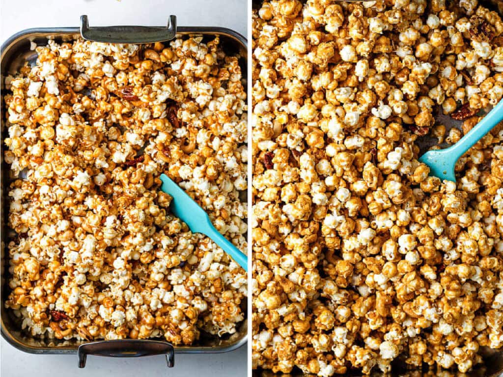 Stirring caramel popcorn in a roasting pan with a silicone spatula.