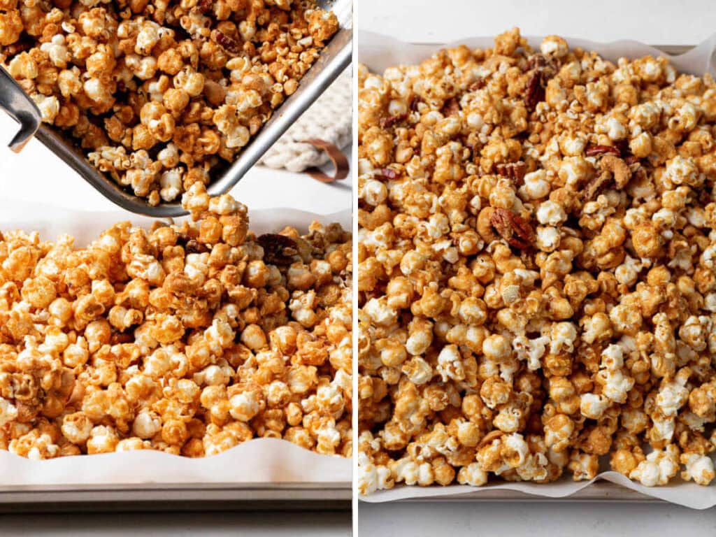 Pouring baked caramel corn onto a parchment lined baking sheet to cool.