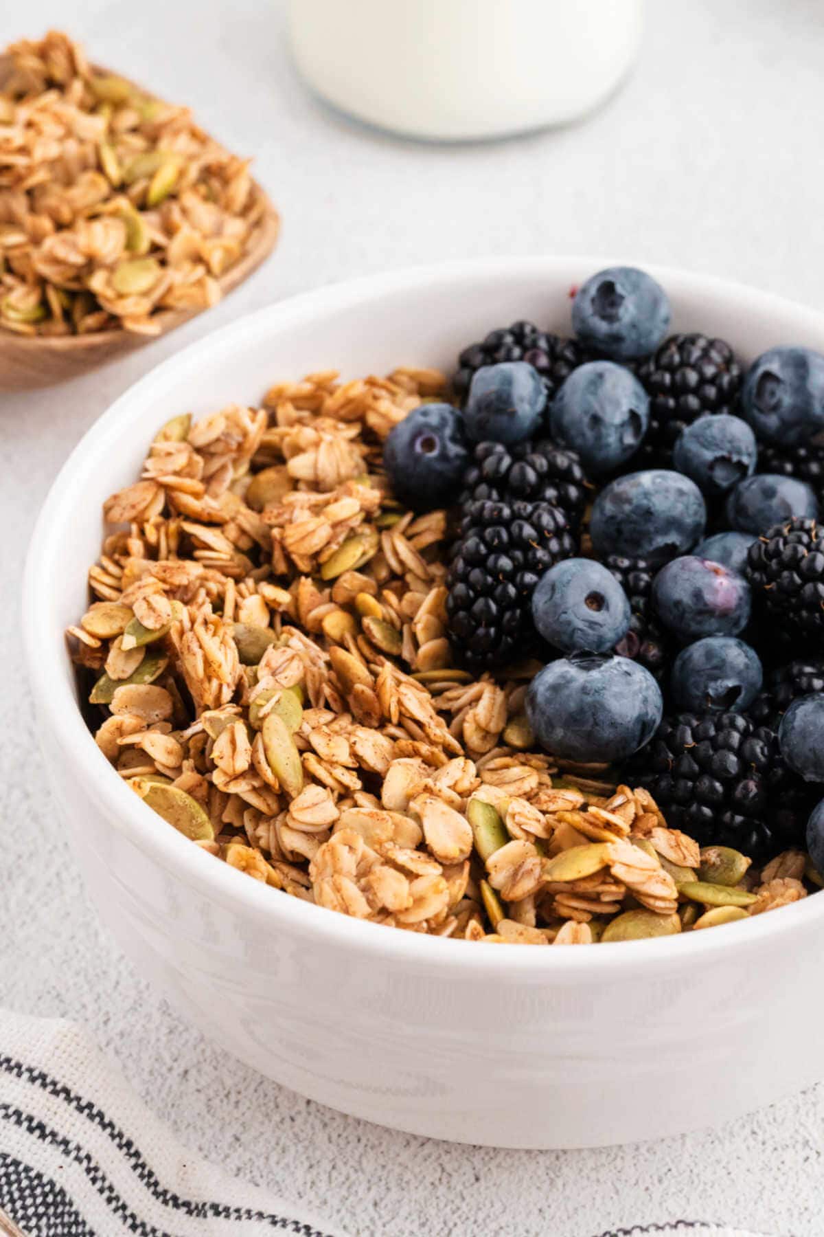 Close up image of a bowl of granola on a table.