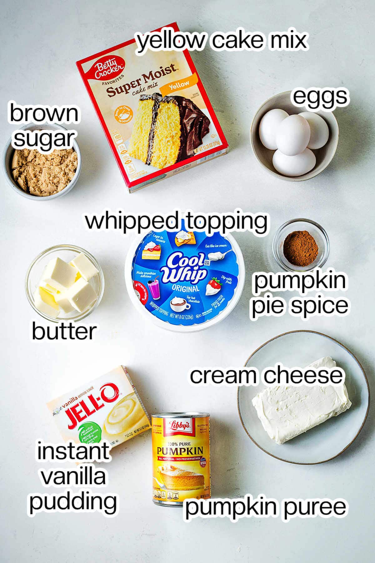 Ingredients for pumpkin dessert bars on a table.