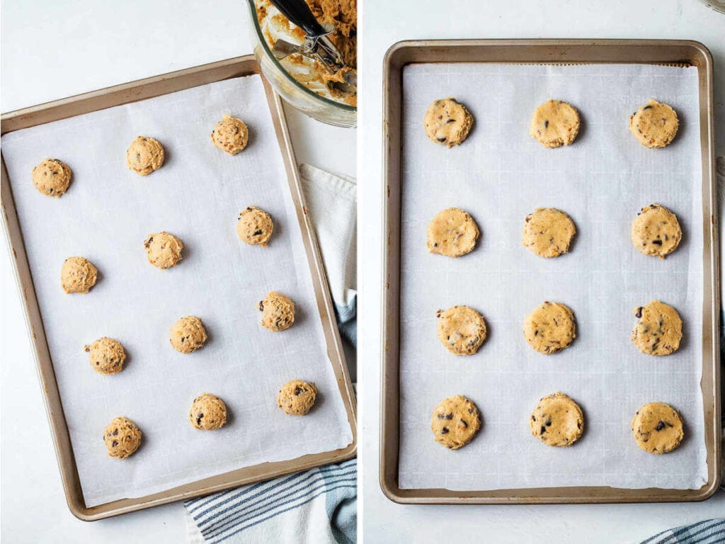 Cookie dough balls flattened on a parchment-lined cookie sheet.