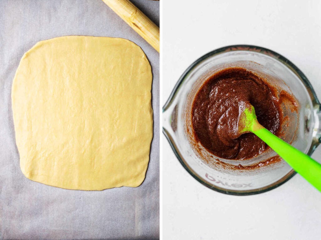 Cookie dough rolled into a square on a wooden board; brown sugar cinnamon mixture in a bowl with a spatula on a table.