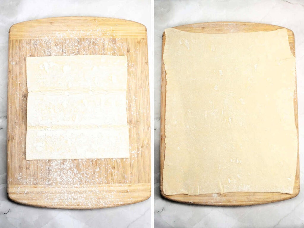 Puff pastry dough rolled out on a lightly dusted wooden board.