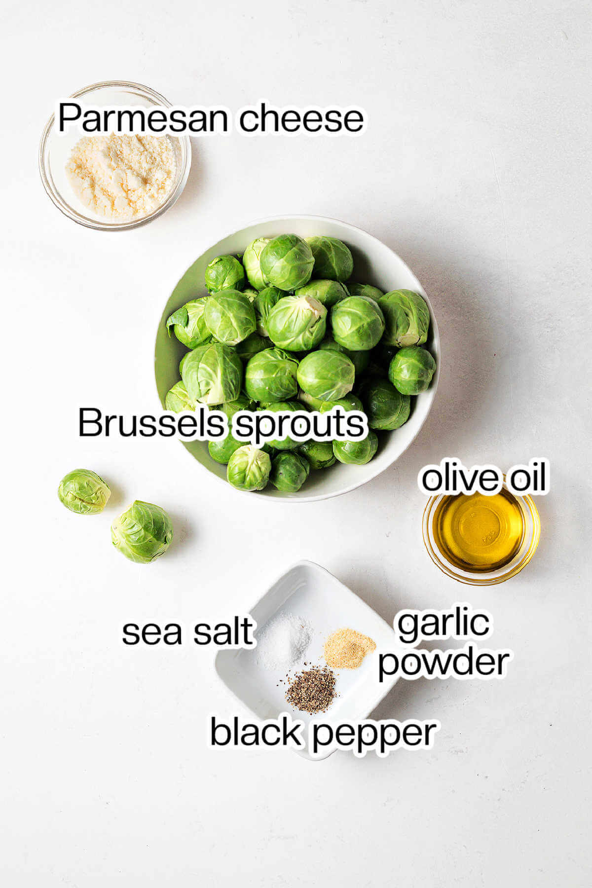 Ingredients for Brussels sprouts with Parmesan on a table.