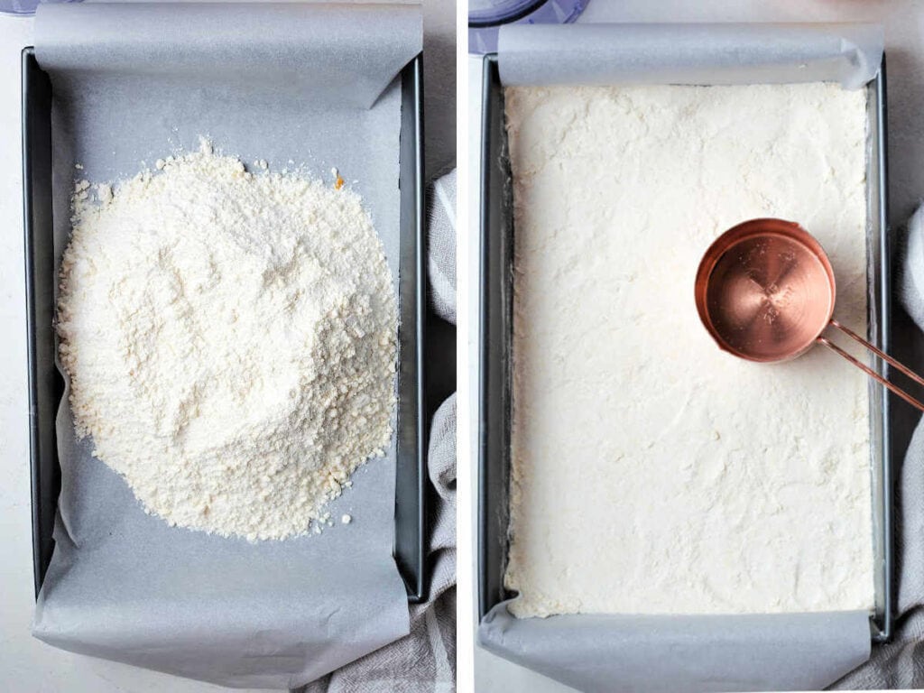 Crumbs emptied into a parchment paper lined baking pan, then being pressed into a crust with a measuring cup.