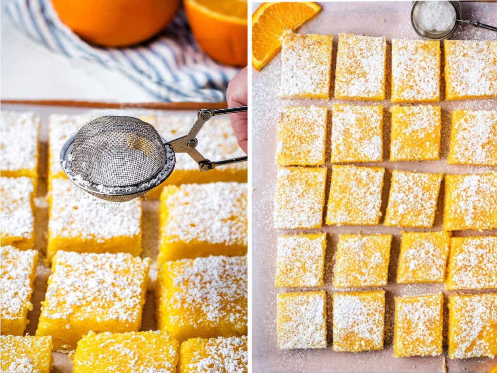 Powdered sugar being sifted on top of sliced orange bars.