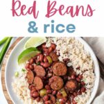 Instant Pot Red Beans and Rice on a plate with lime wedges on a table.