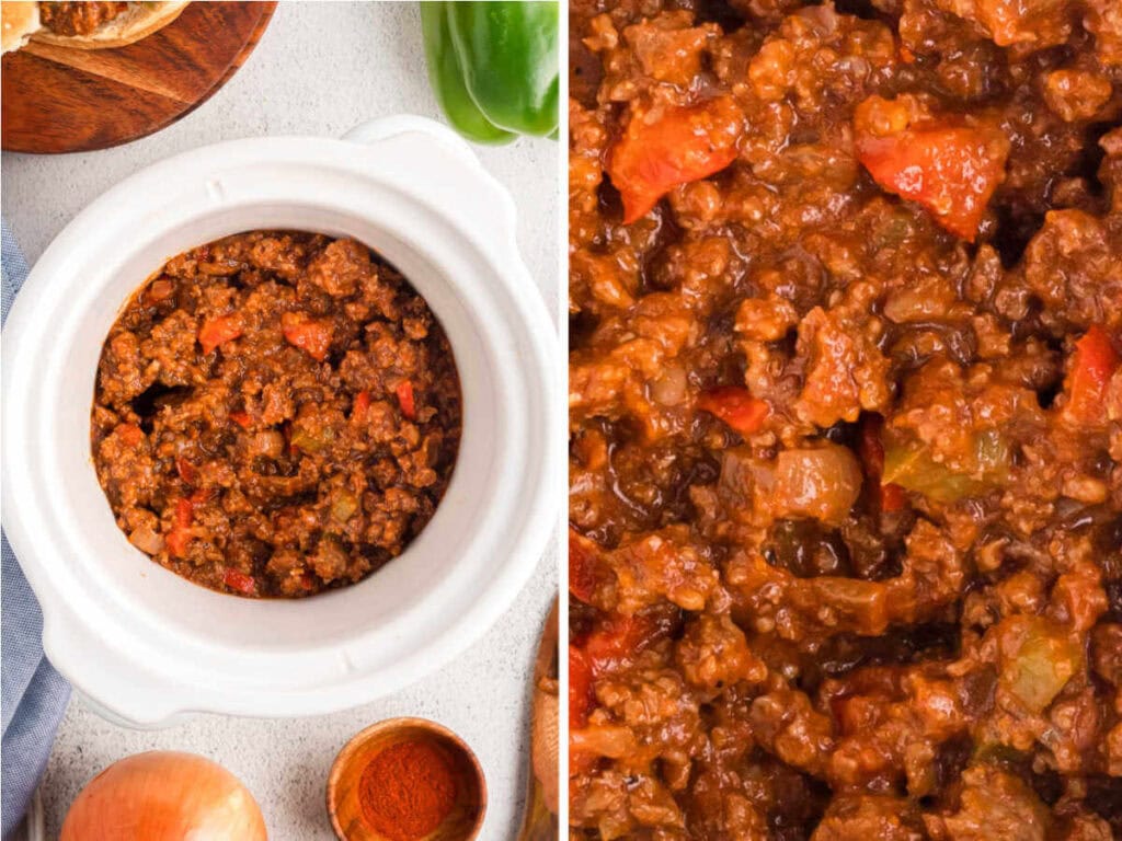 Cooked Sloppy Joes in a slow cooker on a table with bell peppers in the background.