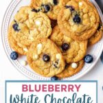 Blueberry Cookies with White Chocolate Chips stacked on a plate.