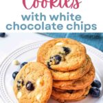 Blueberry Cookies with White Chocolate Chips stacked on a plate.
