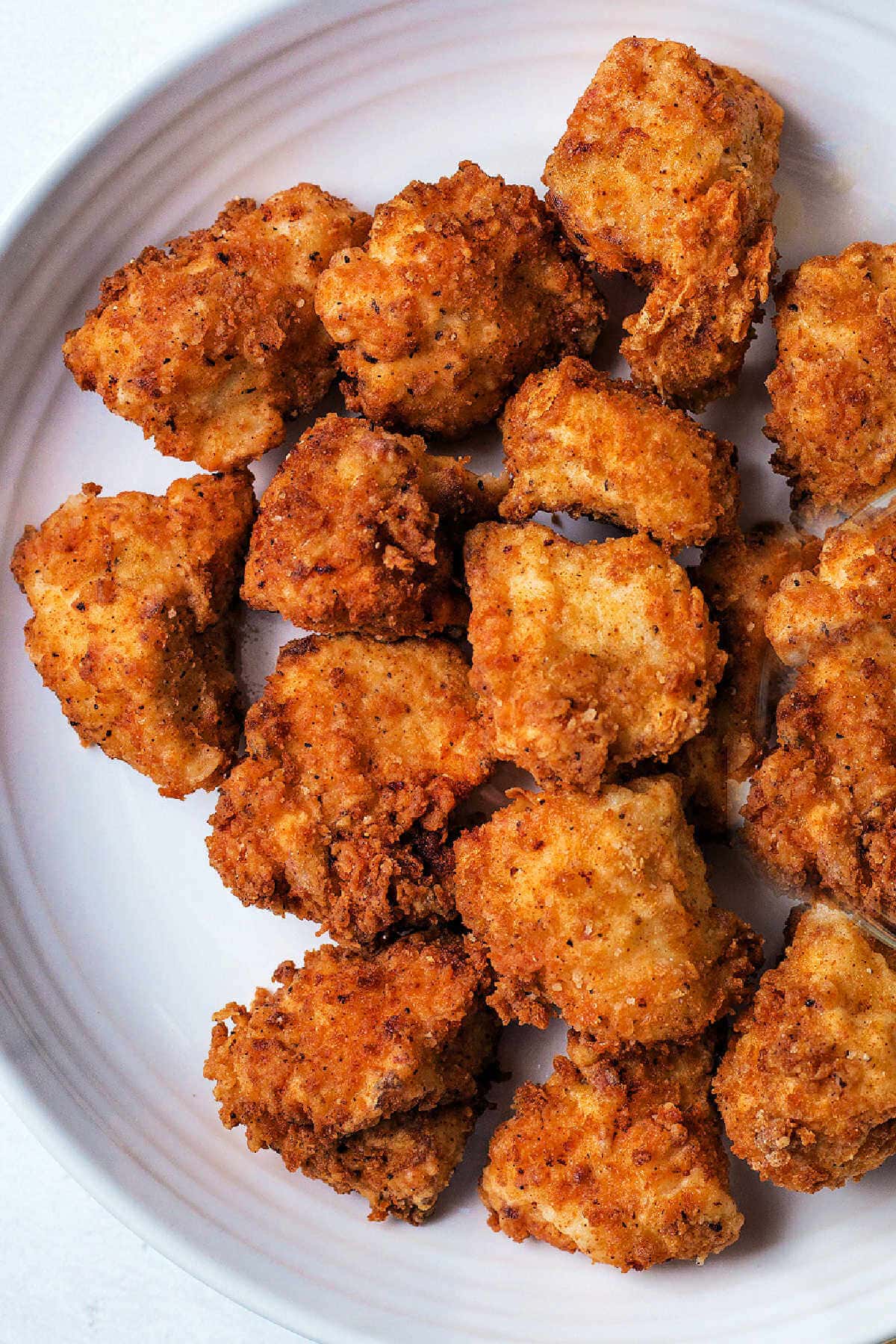Homemade Chick fil-A nuggets on a plate.