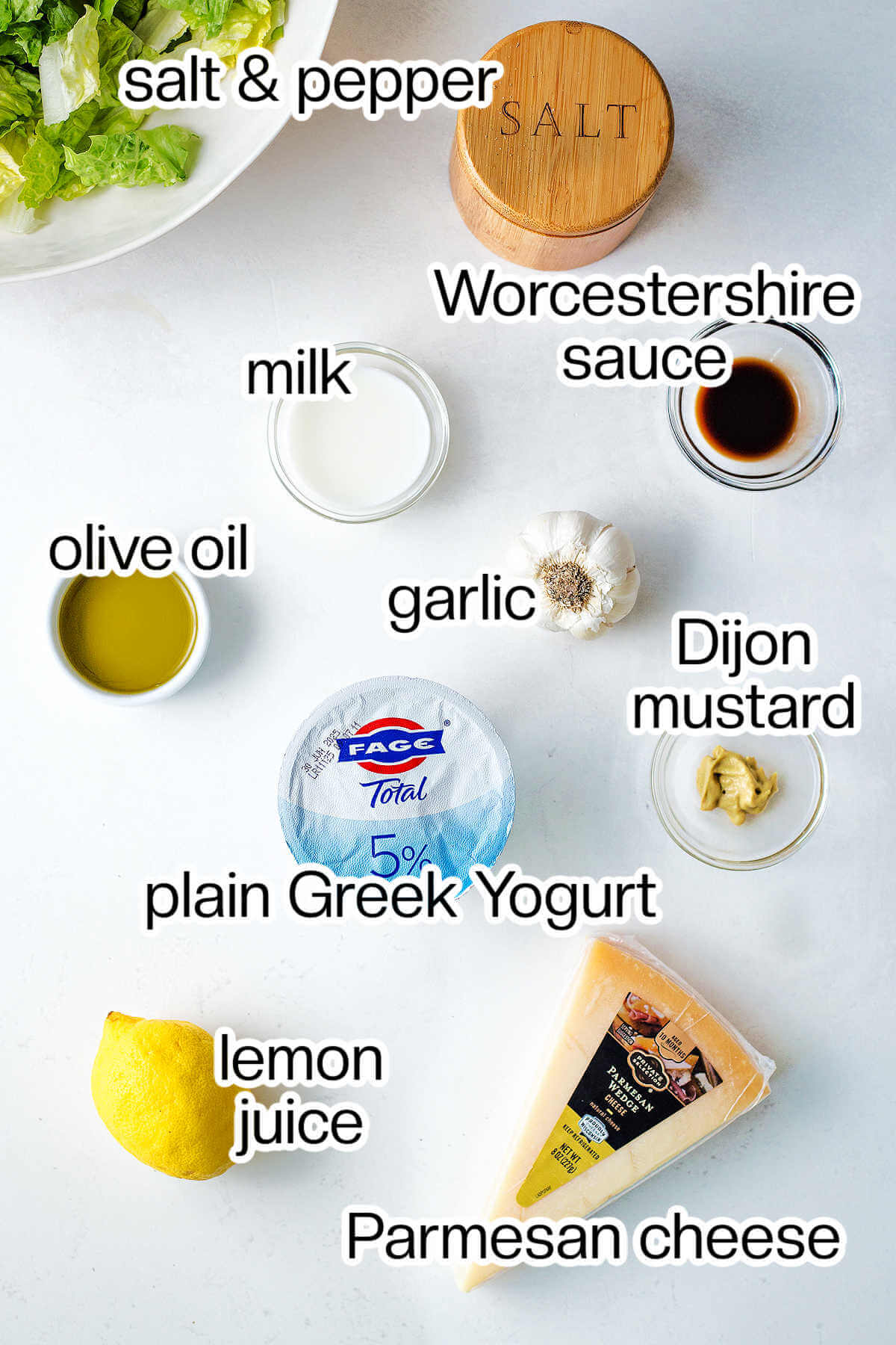 Labeled photo of the ingredients needed to make Greek yogurt caesar salad dressing.