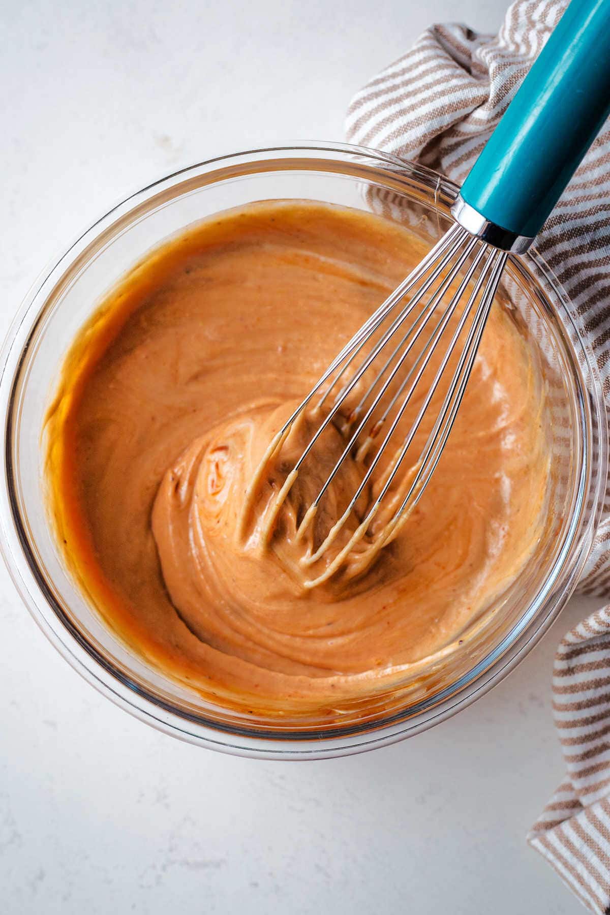 Whisking ingredients together for chick fil a sauce.