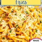 Parmesan Truffle Fries on a plate with dipping sauce to the side.
