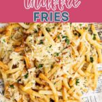 Parmesan Truffle Fries on a plate with dipping sauce to the side.