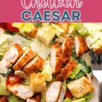 Blackened Chicken Caesar Salad on a plate on a table.