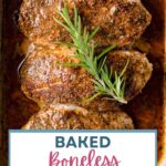 Baked Pork Loin Chops garnished with rosemary.