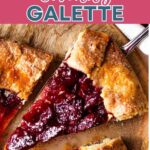 A slice of Rustic Cherry Tart (Cherry Galette) on a wooden board.